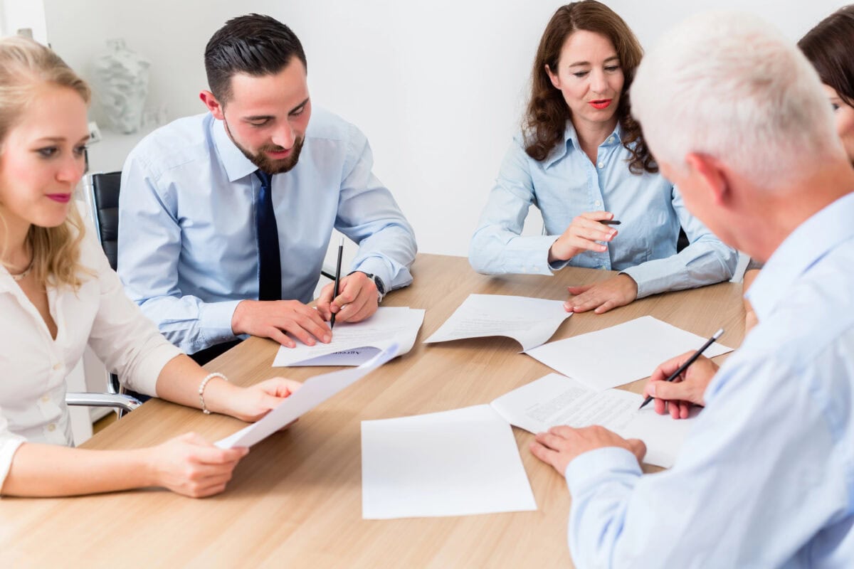 Lawyers having team meeting in law firm