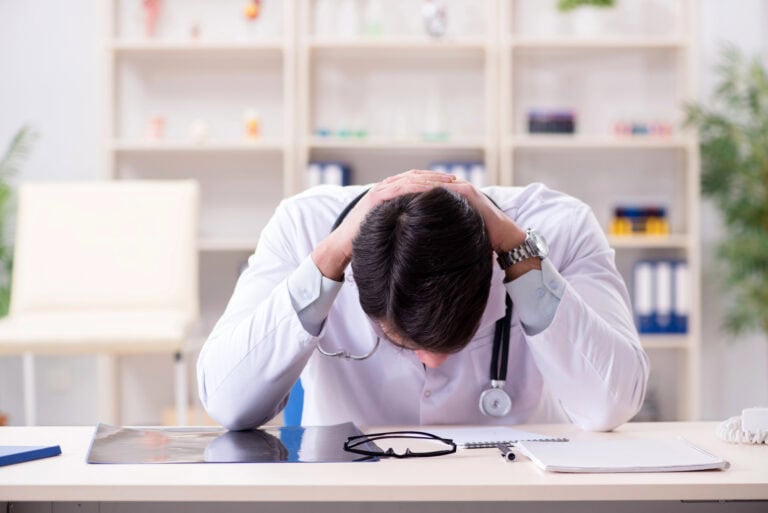 Young doctor sitting in the office