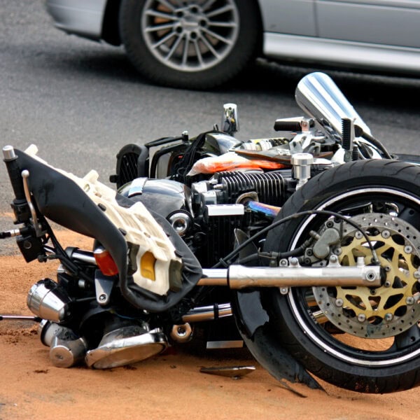 Black motorbike accident on the asphalt road